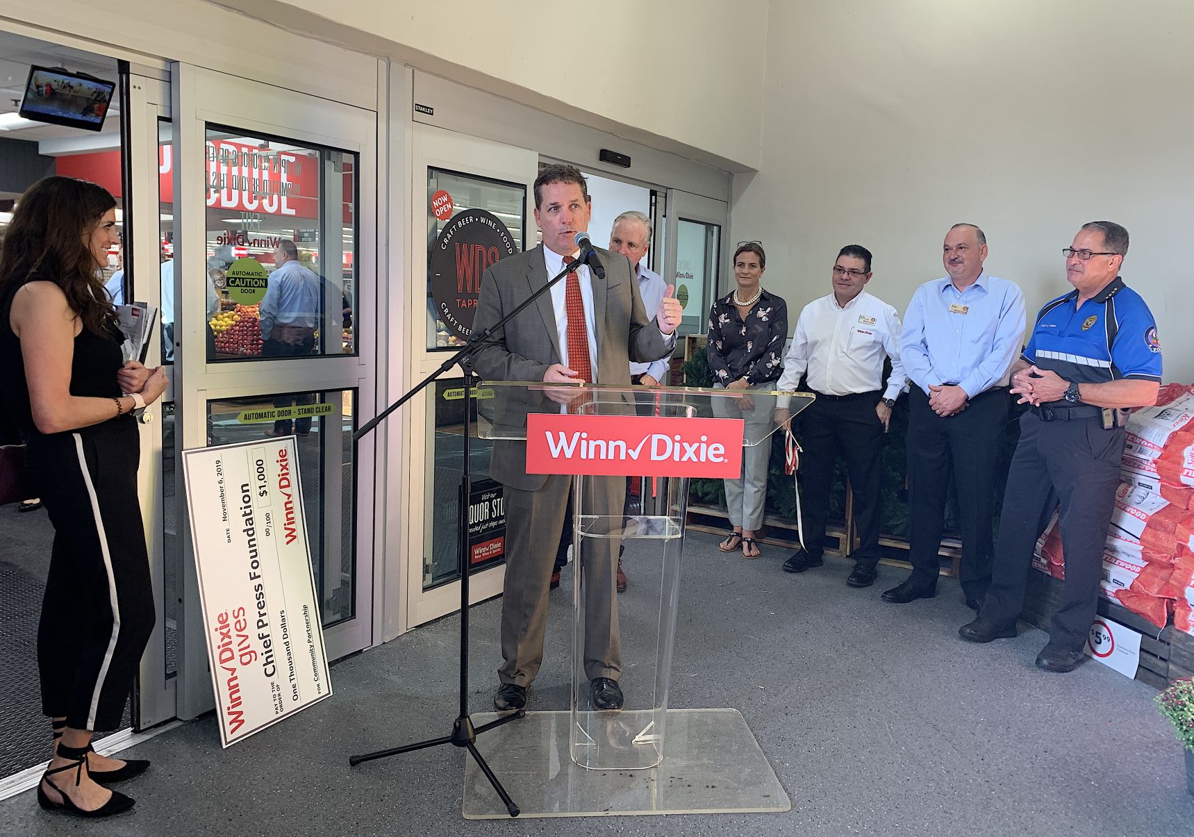 Mayor Davey addresses attendees during Winn Dixie's Key Biscayne store Grand Reopening Celebration